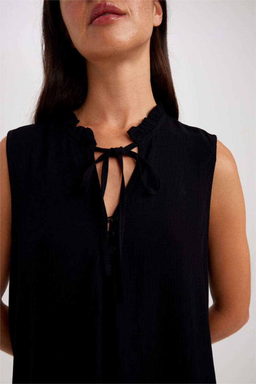 حريمي أسود بلوزة بدون أكمام بقصة عادية بياقة مكشكشة