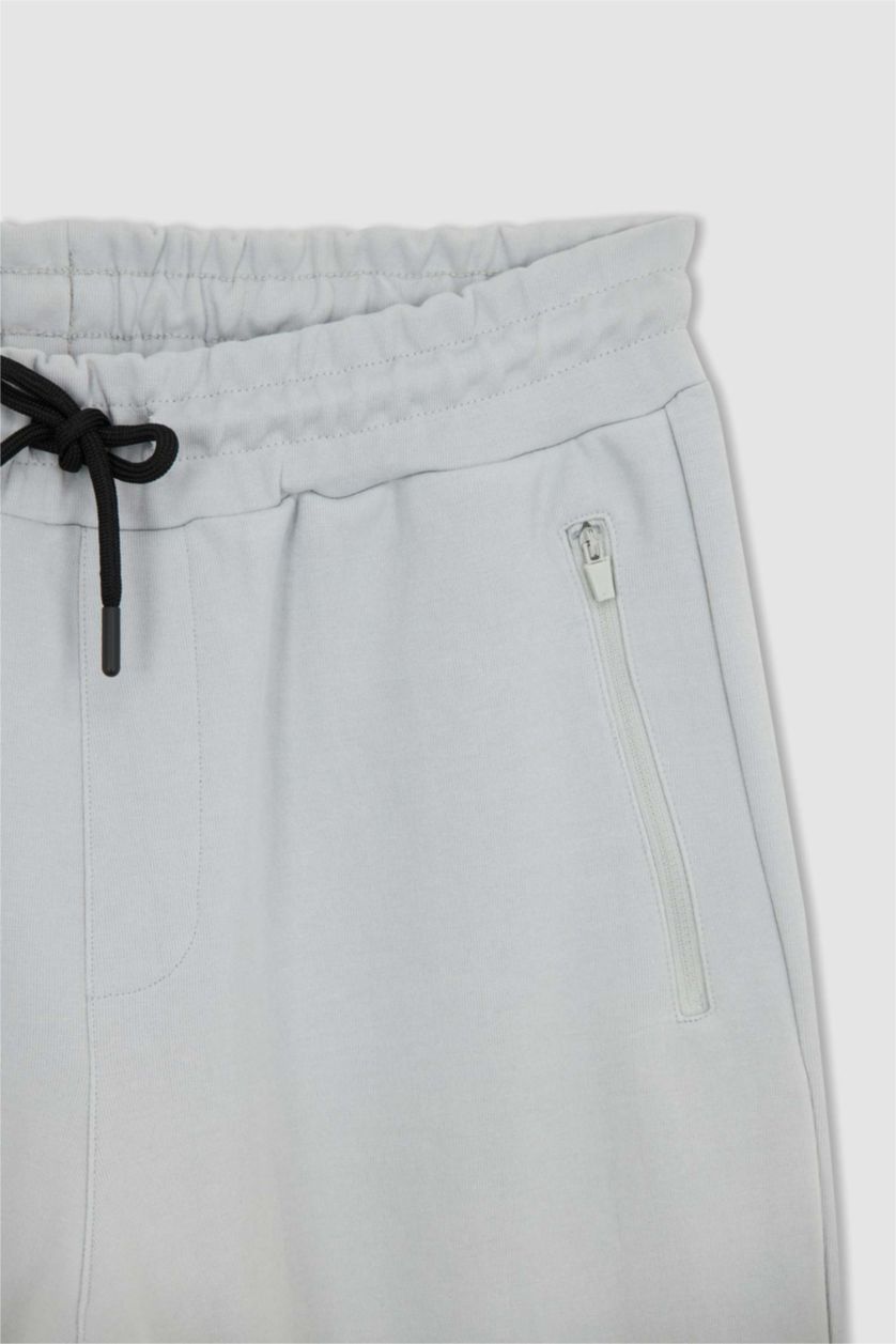 رجالي رمادي فاتح بنطلون سويت بانتس رياضي سليم فيت من DeFactoFit