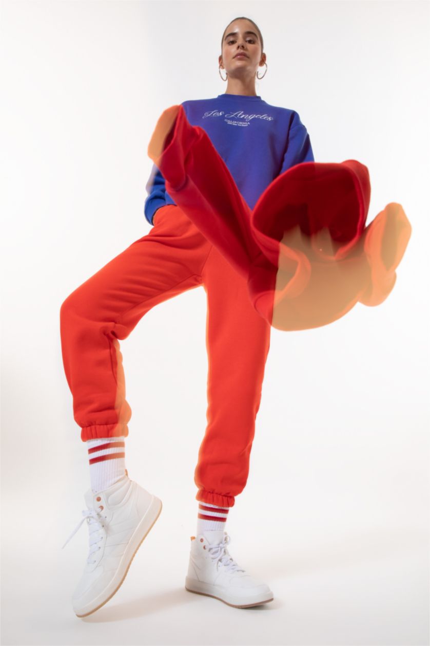 حريمي أحمر بنطلون جوجر قصة عادية بحافة مطاطي