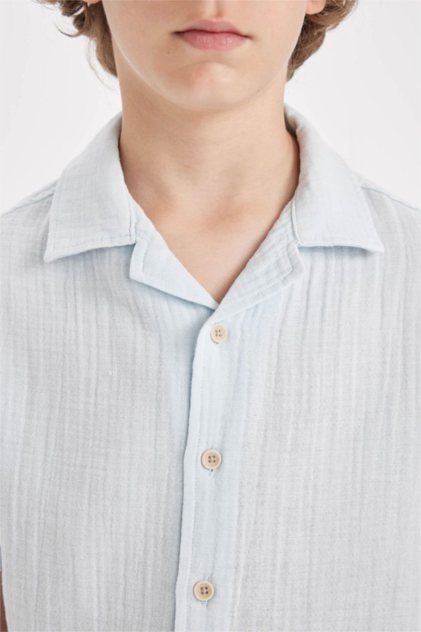 أولاد أزرق فاتح قميص بولو ولادي نص ردن موسلين اوفر سايز