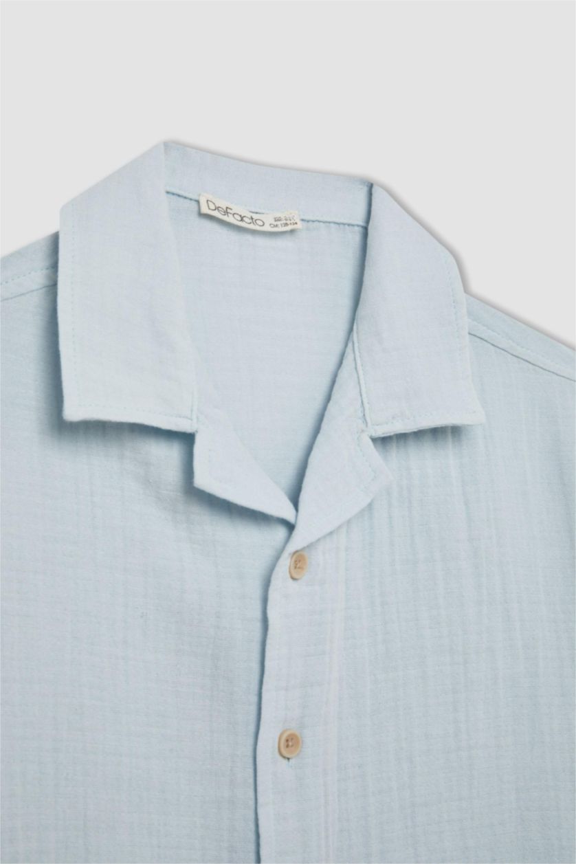 أولاد أزرق فاتح قميص بولو ولادي نص ردن موسلين اوفر سايز