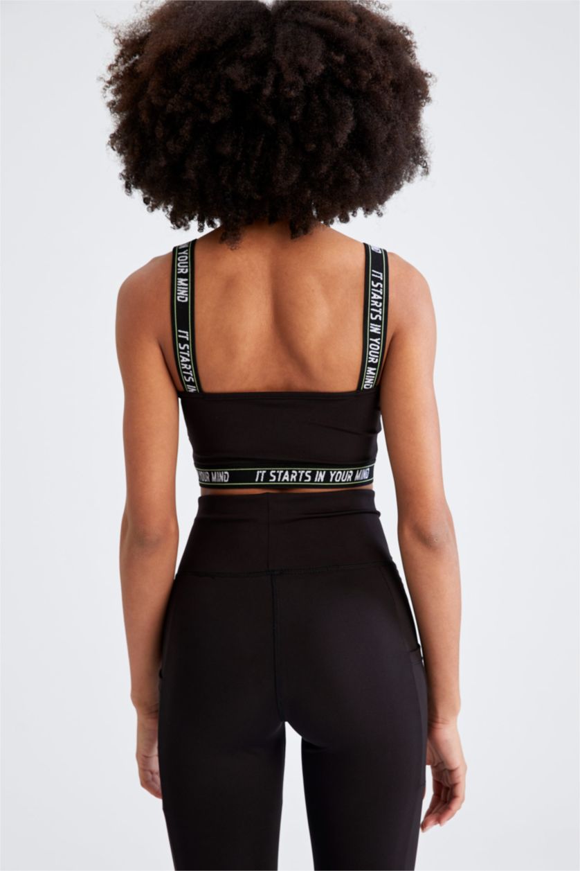 Woman Black Strappy Slogan Print Sports Bra