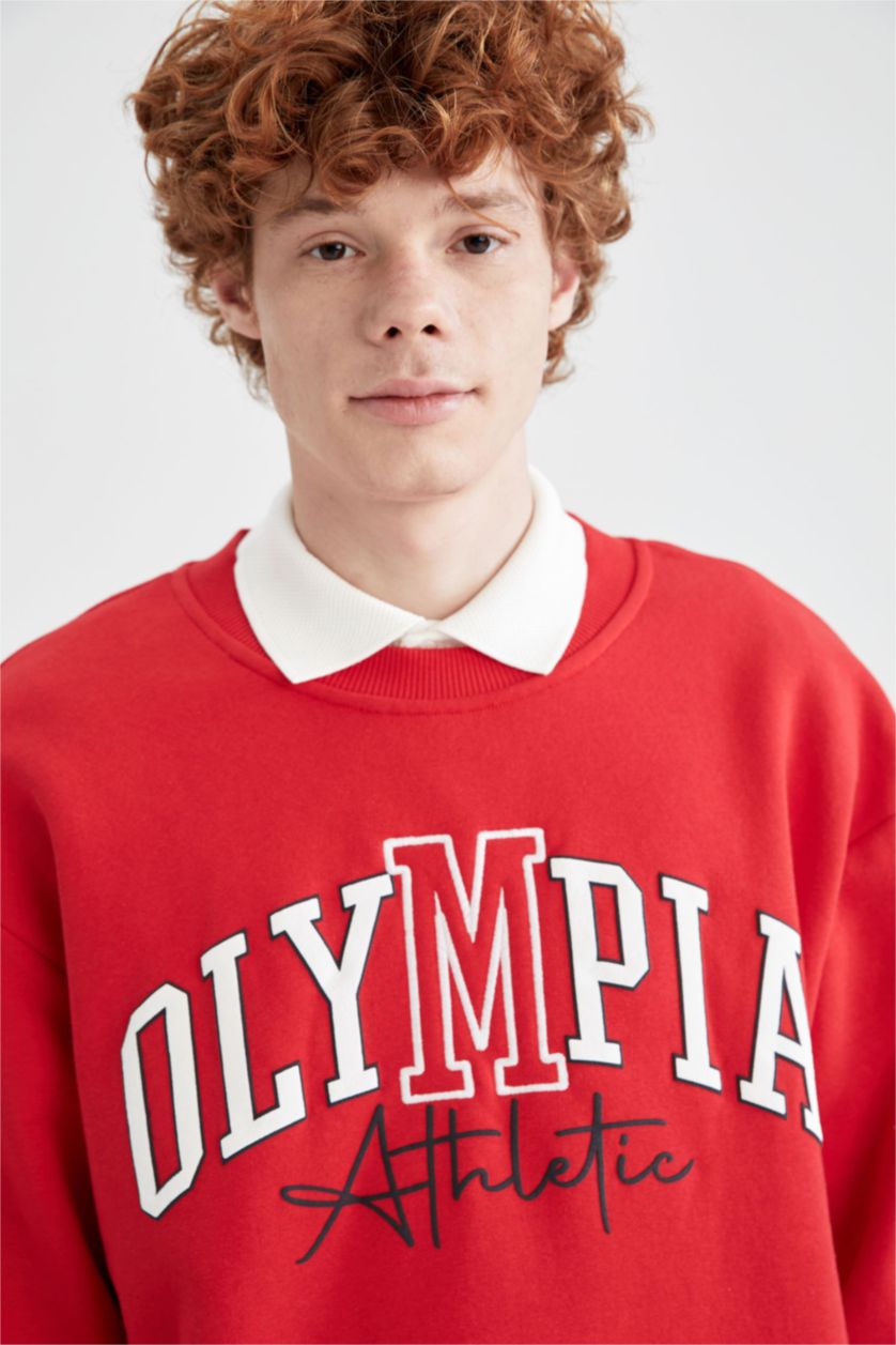 HOMME Rouge Sweat-shirt oversize à manches longues et col ras du cou imprimé