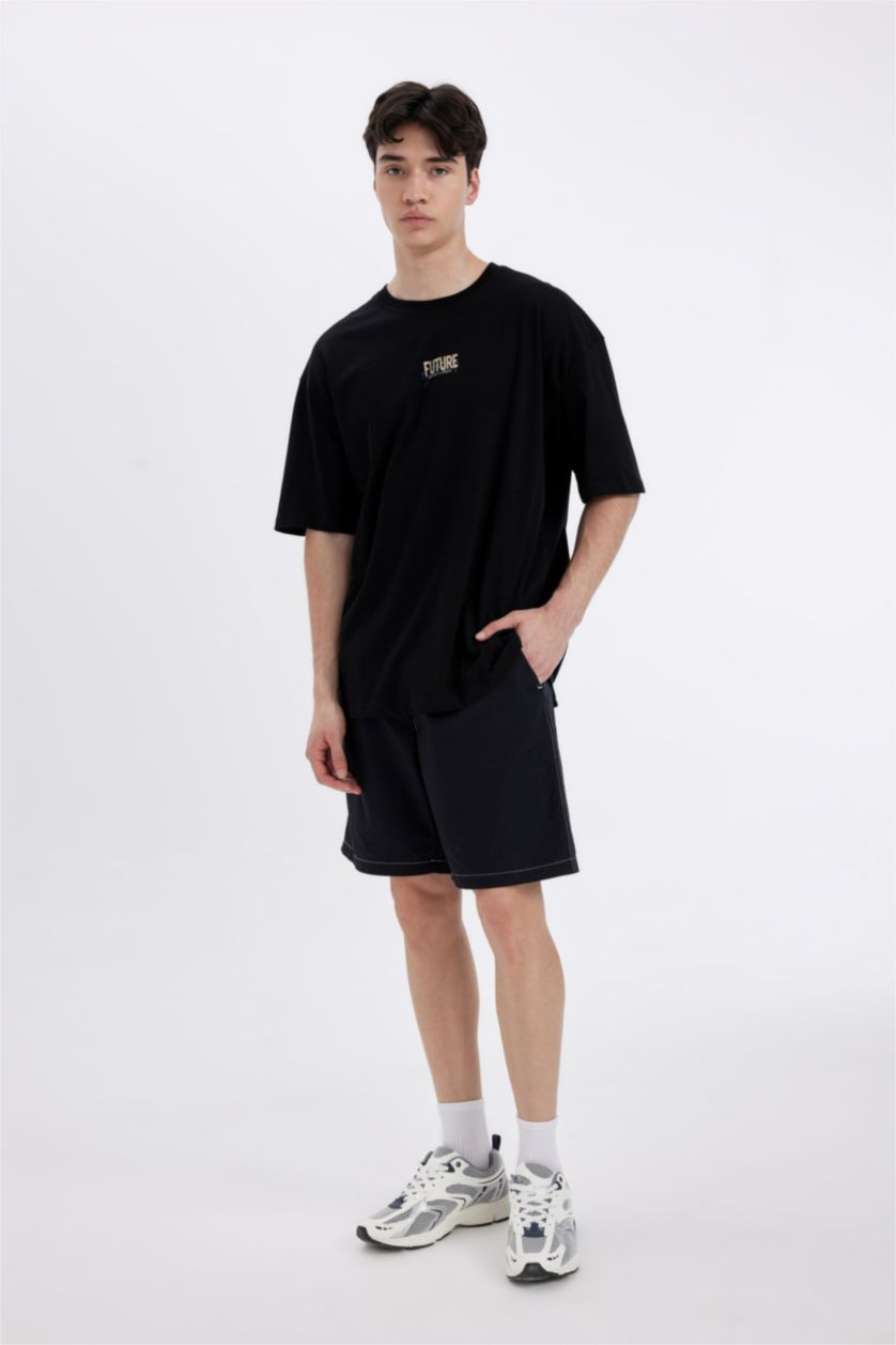 رجال أسود تي شيرت بأكمام قصيرة مطبوع بياقة مستديرة اوفر سايز