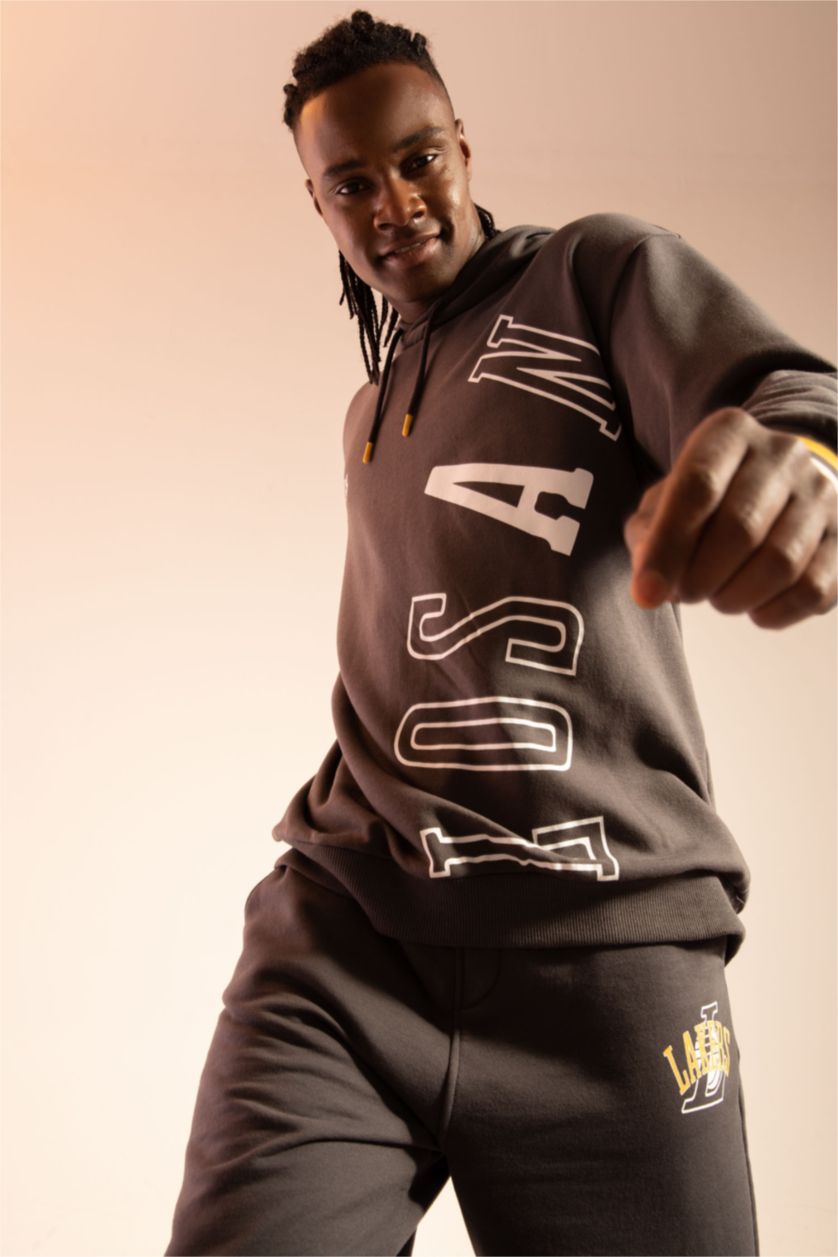 رجالي أنثرا سويت شيرت بغطاء للرأس من ديفاكتو فيت إن بي إيه ليكرز مرخص