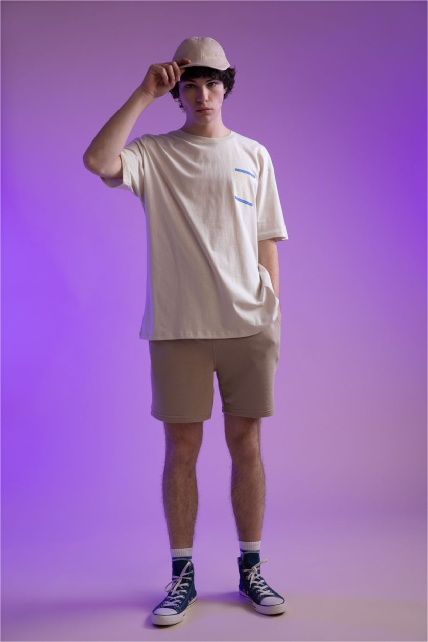 HOMME Beige Short coupe slim en tissu épais avec poche