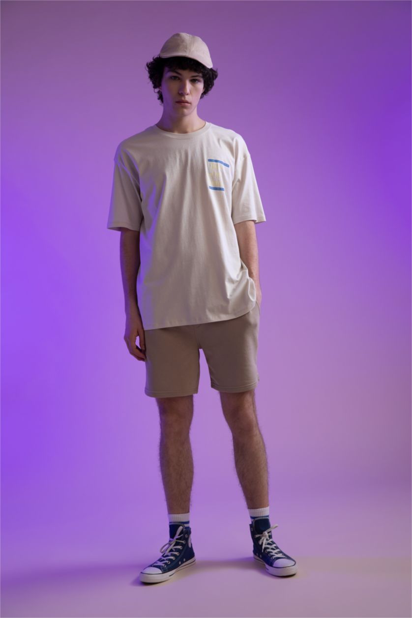 HOMME Beige Short coupe slim en tissu épais avec poche