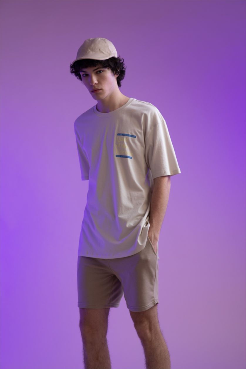 HOMME Beige Short coupe slim en tissu épais avec poche