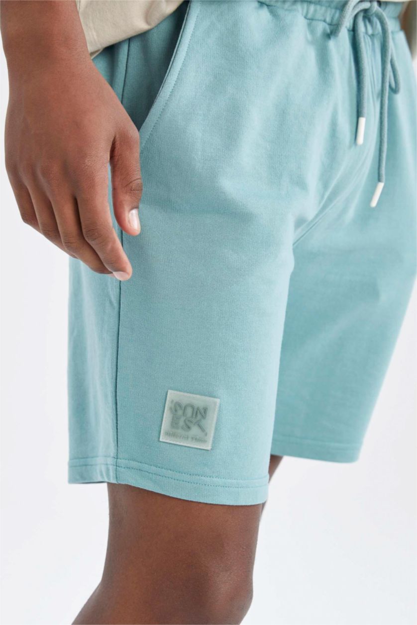 HOMME Vert Short coupe slim en tissu fin avec poche