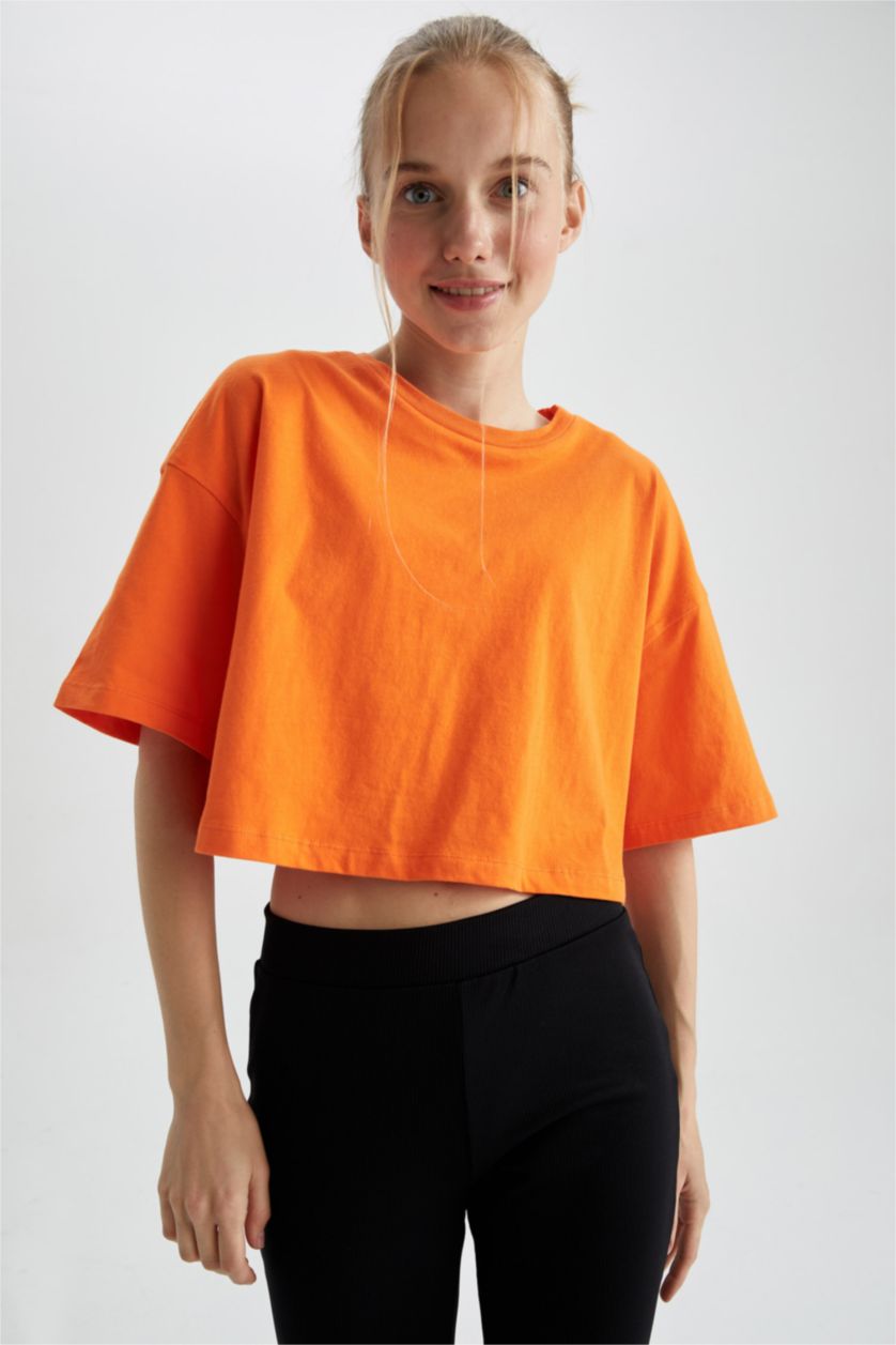 حريمي برتقالي تي شيرت قطن بأكمام قصيرة وقصة فضفاضة