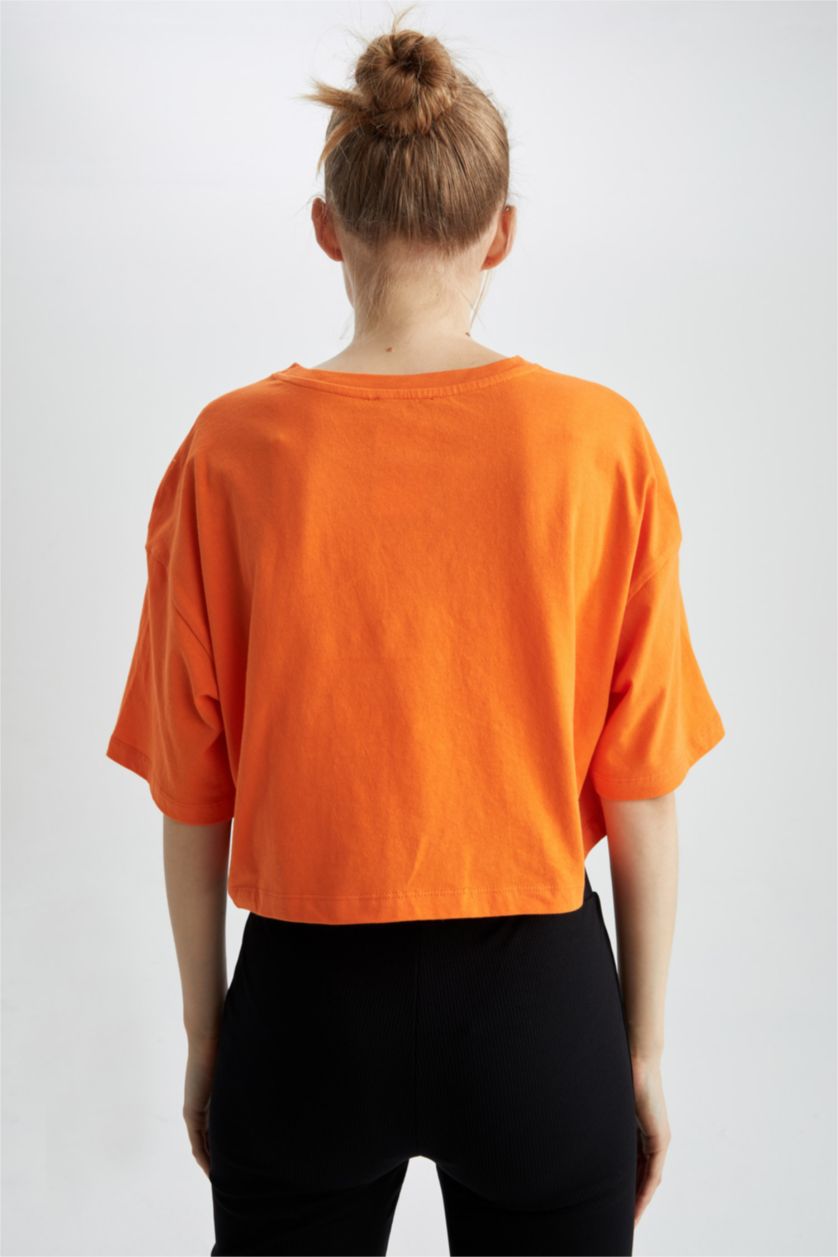 حريمي برتقالي تي شيرت قطن بأكمام قصيرة وقصة فضفاضة