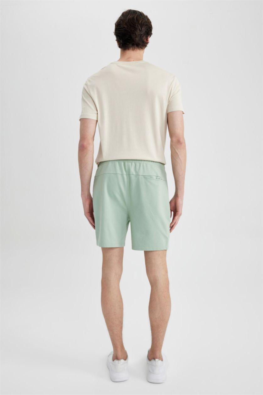 رجال أخضر فاتح شورت سليم فيت بساق ضيق