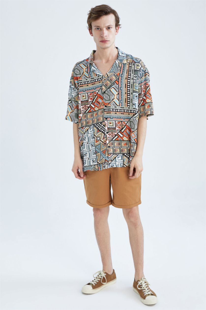 HOMME Orange Chemise oversize à manches courtes en popeline à motifs