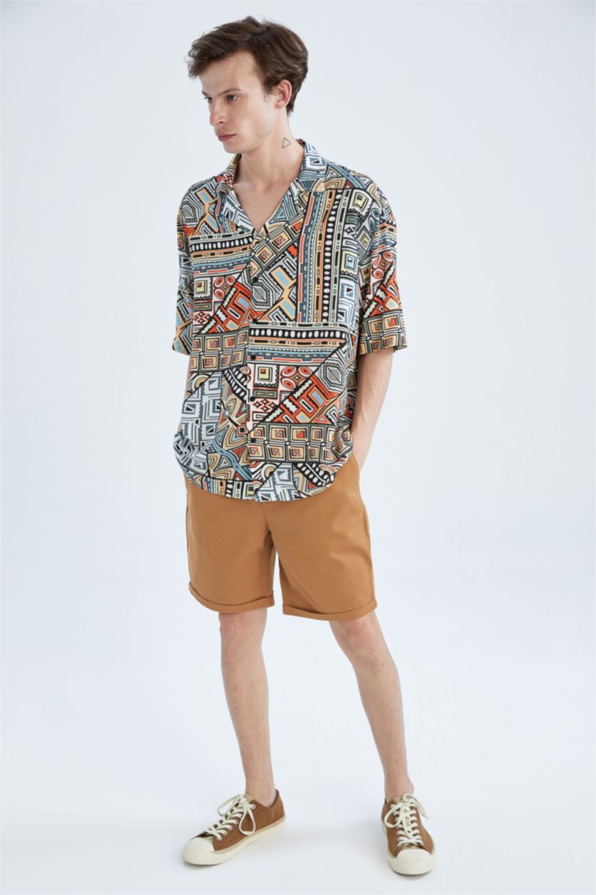 HOMME Orange Chemise oversize à manches courtes en popeline à motifs