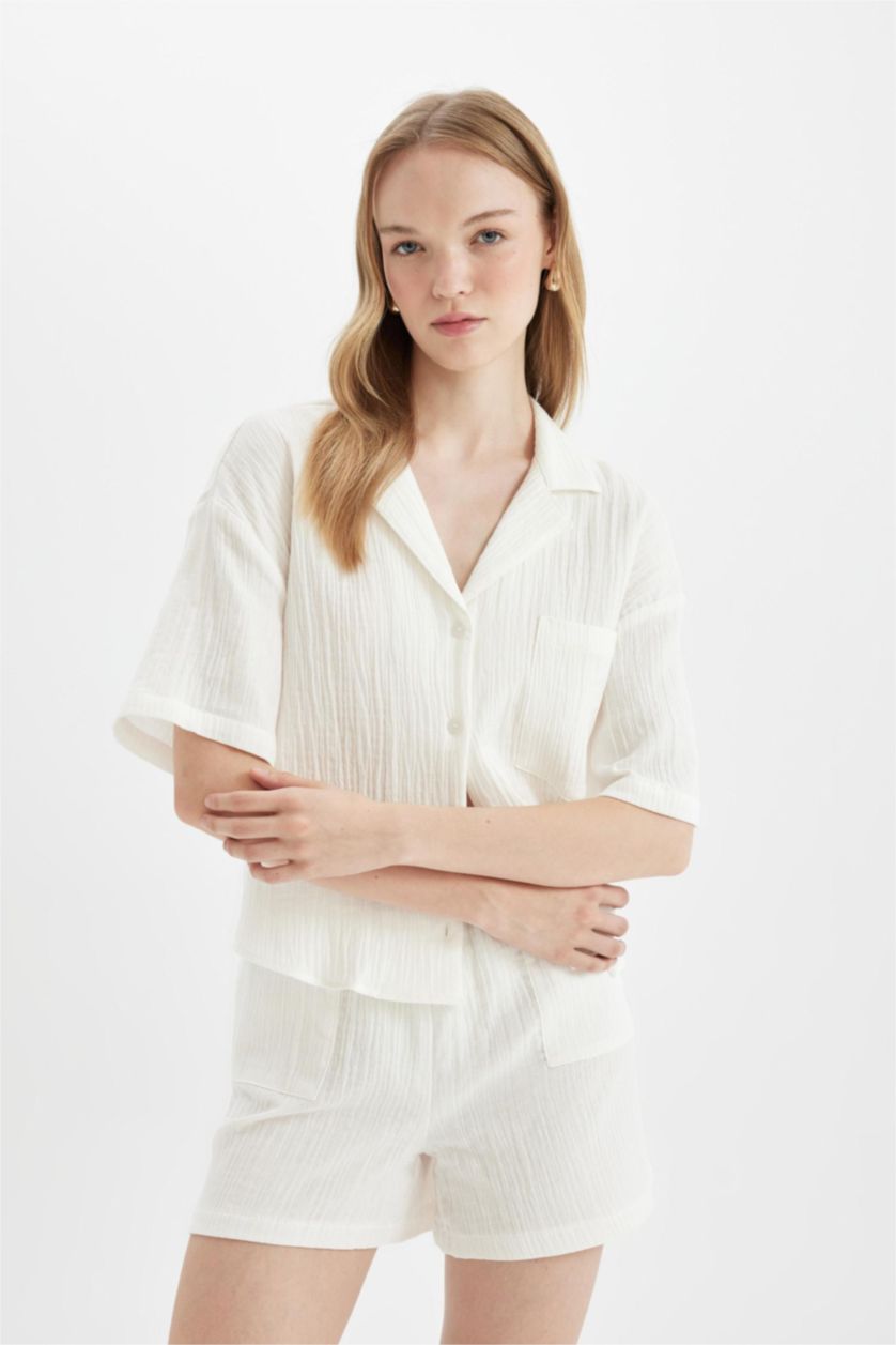 حريمي اوف وايت شورت قصير موسلين قصة عادية بجيب وخصر عادي