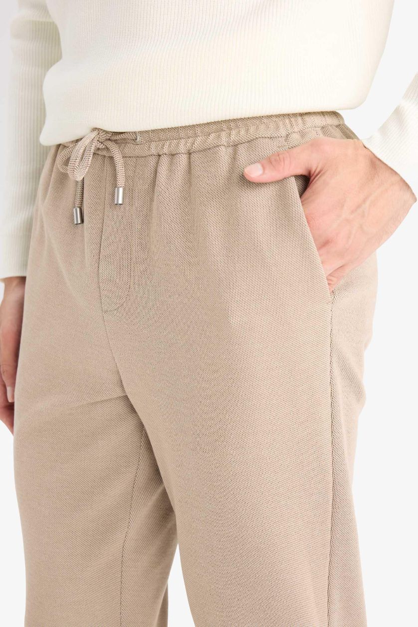 Erkek Bej Jogger Fit Beli Bağcıklı Lastikli Esnek Kumaş Cepli Duble Paça Pantolon