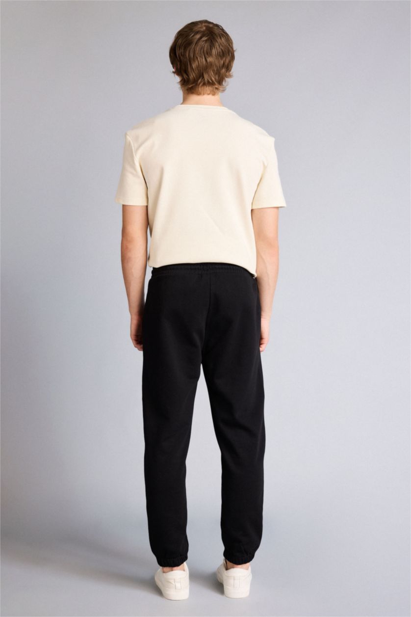 Man Black Regular Fit Zipper Pocket Printed Trousers