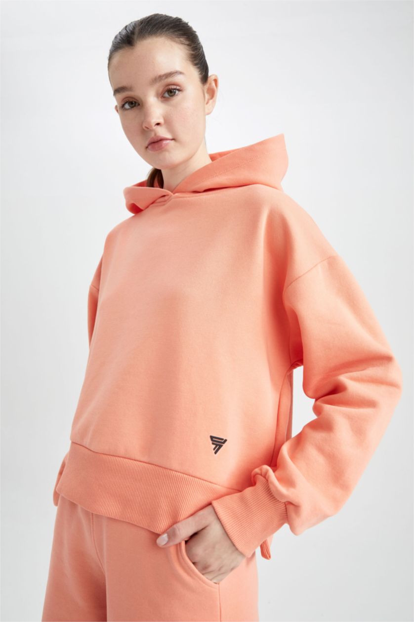 حريمي مرجاني سويت شيرت بكابيشون من DeFactoFit