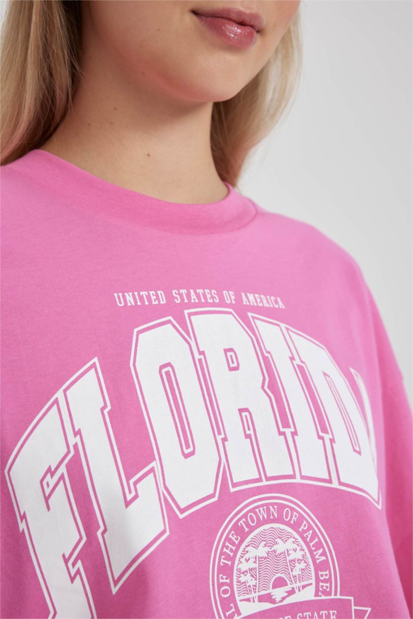 نساء زهري تي شيرت نص كم وقصة واسعة