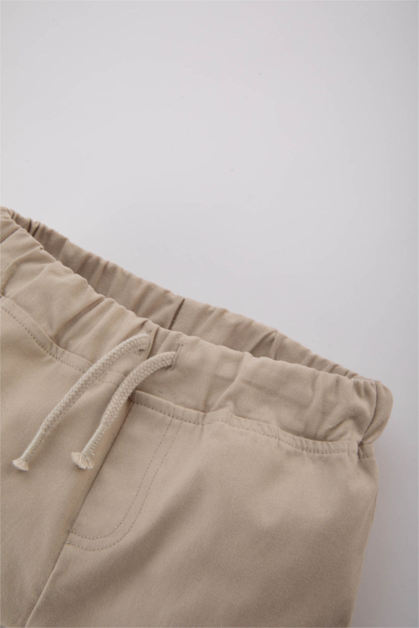 طفل صغير بيج بنطلون كارجو بيبي اولادي جبردين قصة عادية بجيب