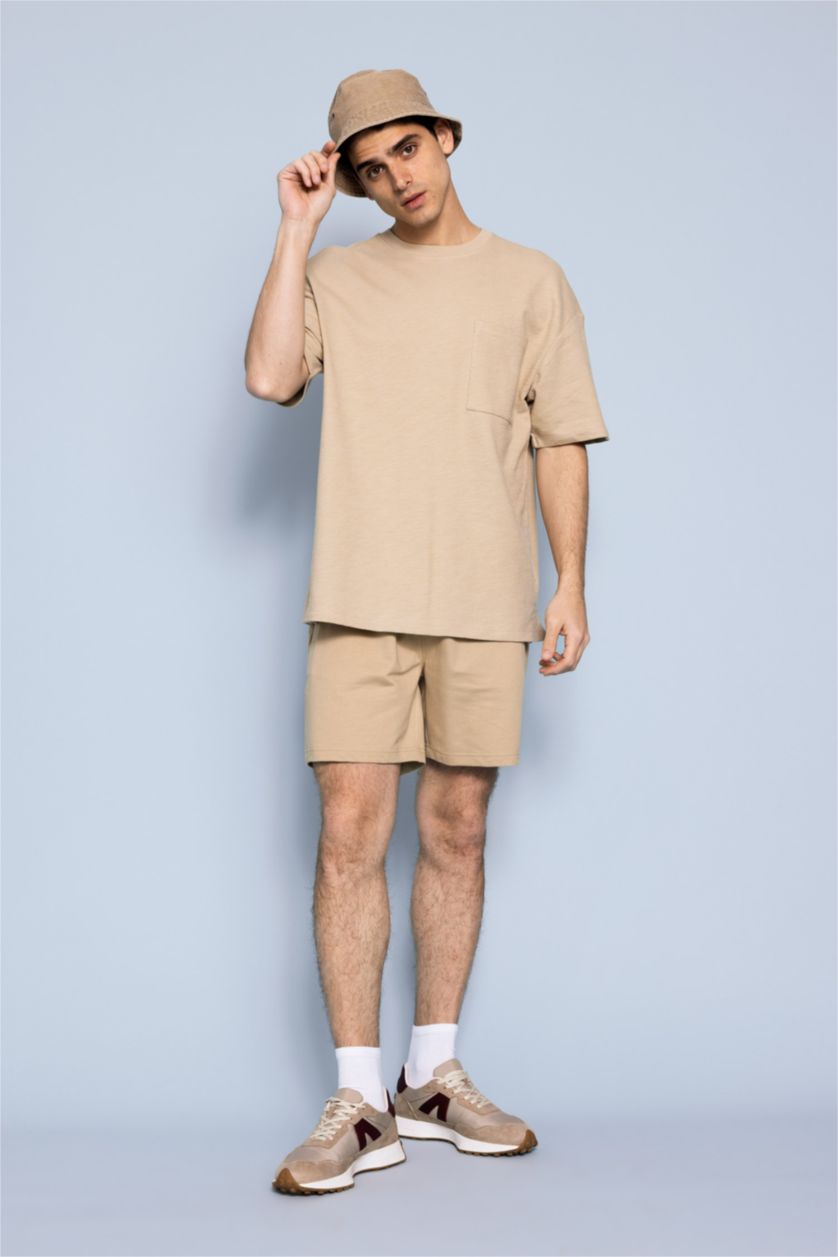 HOMME Beige Short en coton à coupe régulière