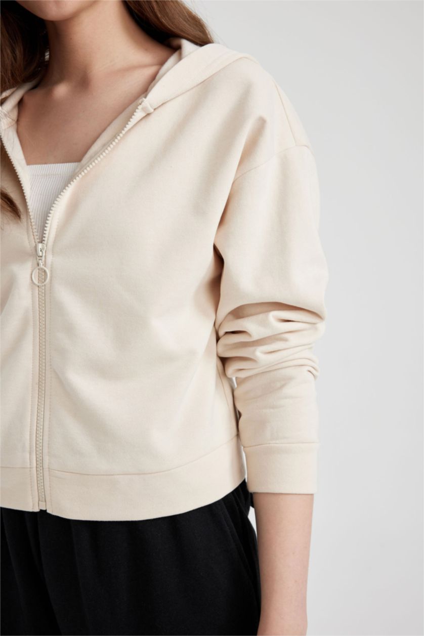 حريمي بيج فاتح سويت شيرت بيزك خفيف قصة عادية بكابيشون