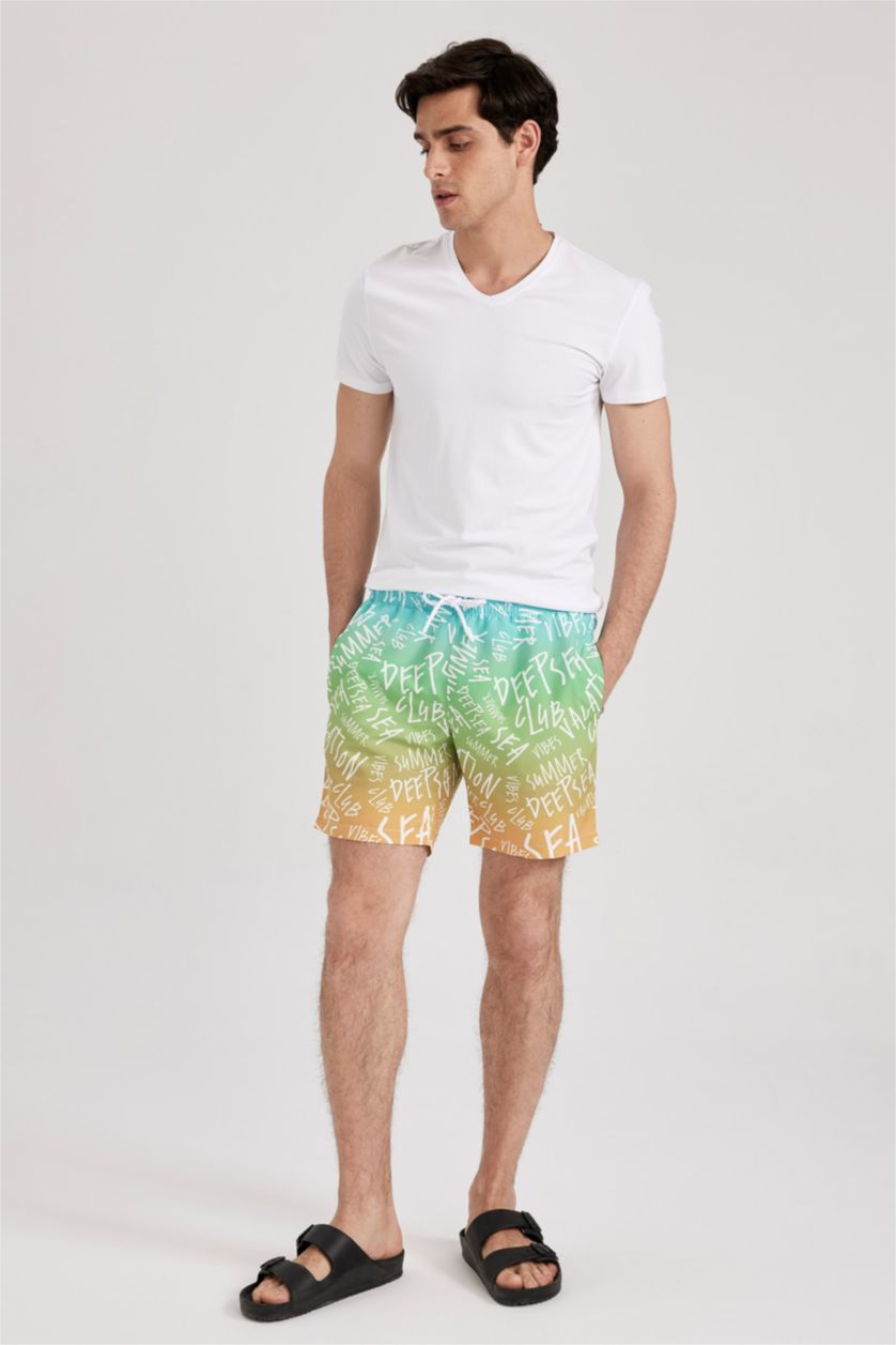 HOMME Bleu Short de Bain coupe régulière imprimé