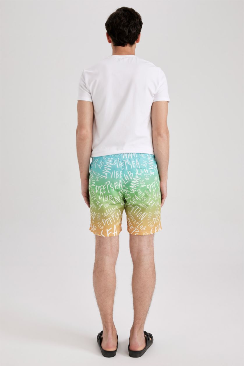 HOMME Bleu Short de Bain coupe régulière imprimé