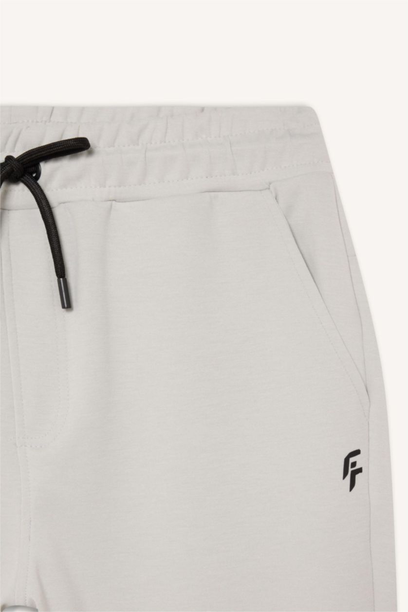 رجال رمادي فاتح بنطلون بجامة رياضي قماش سكوبا سليم فيت برجل مطاطي من DeFactoFit