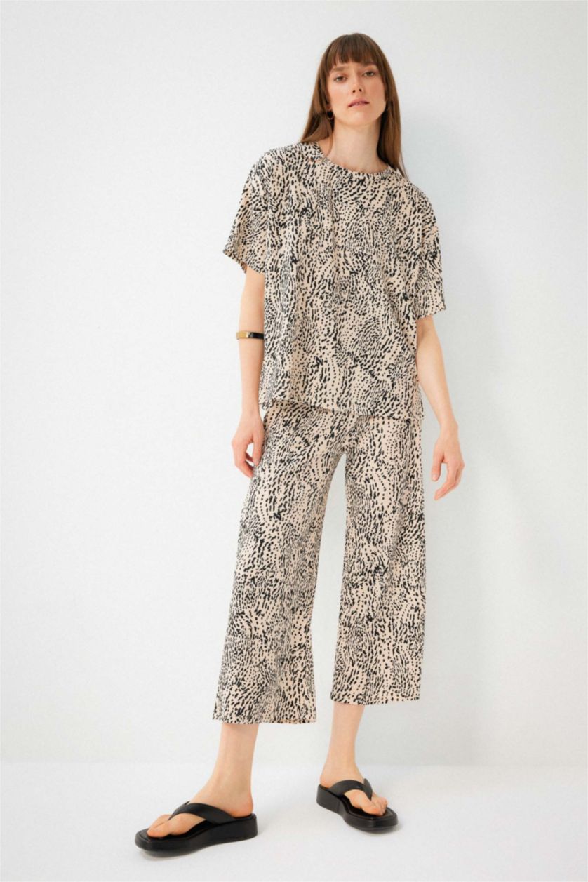 نساء بيج سروال جلد النمر قصة عادية