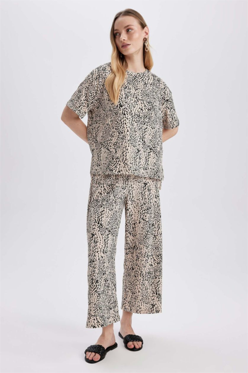 نساء بيج سروال جلد النمر قصة عادية