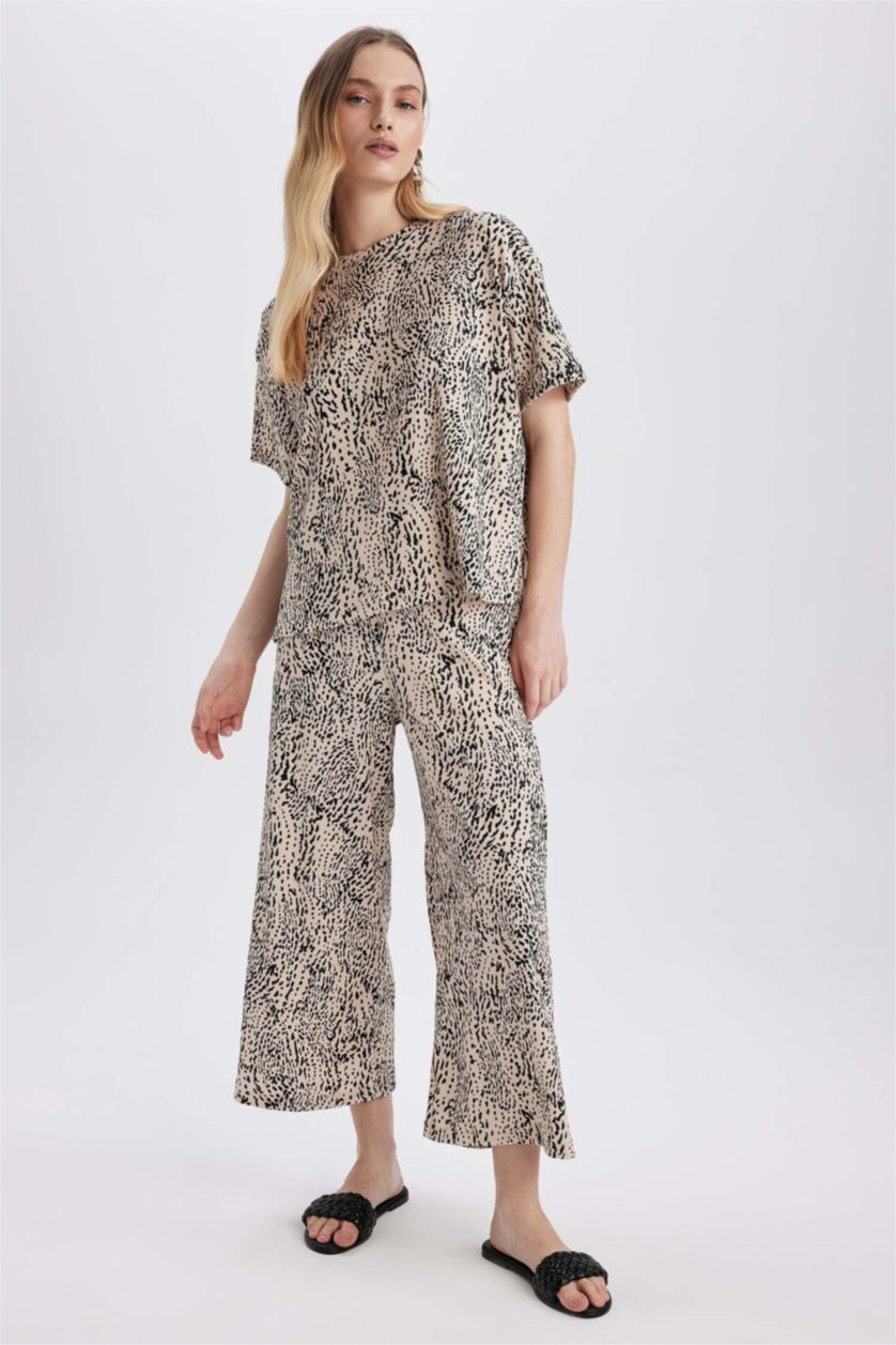 نساء بيج سروال جلد النمر قصة عادية