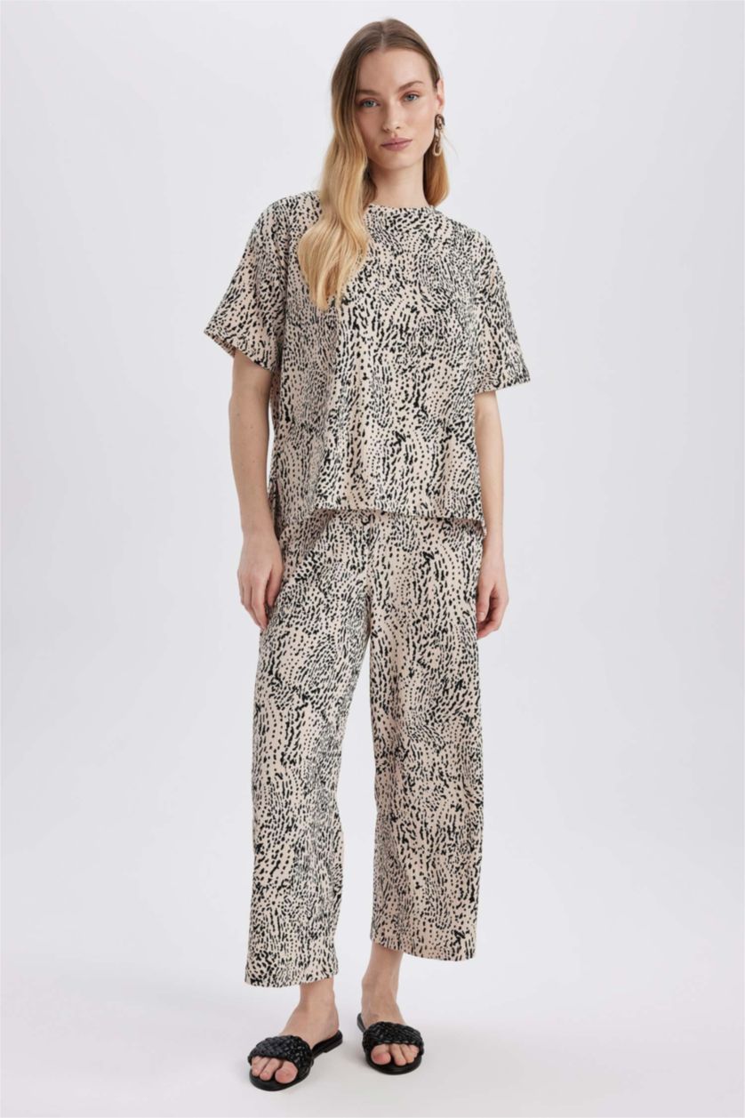 نساء بيج سروال جلد النمر قصة عادية